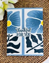 Handmade greeting card with flowers on it and thankful for you sentiment on it.