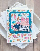 Handmade greeting card with leaves on it and happy autumn sentiment on it.