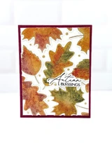Handmade greeting card with leaves on it and Autumn Blessings sentiment on it.