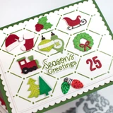 Handmade greeting card with Christmas trinkets on it and season's greetings sentiment on it and 25 sentiment on it.