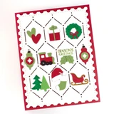 Handmade greeting card with Christmas trinkets on it and season's greetings sentiment on it.