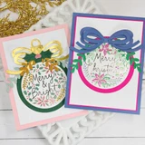 Two handmade greeting cards with ornaments on each and different holiday sentiments on each.