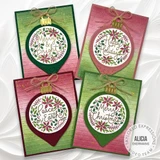 Four handmade greeting cards with ornaments on each and different holiday sentiments on each of them.