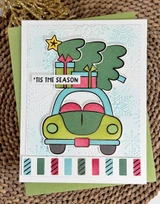Handmade greeting card with car and Christmas tree with 'tis the season sentiment on it.