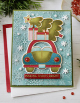 Handmade greeting card with car and tree on it and making spirits bright sentiment on it.