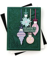 Handmade greeting card with ornaments on it and season's greetings sentiment on it.