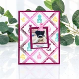 Handmade greeting card featuring bright pink metallic foil, diamond-shaped stitched patterns, and a layered central focal point.