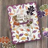 Handmade autumn greeting card featuring colorful fall leaves in purple, orange, and gold, a decorative botanical frame, and a For You sentiment.