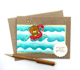 Handmade greeting card of bear in pool floaty with you make me smile sentiment on it.