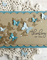 Handmade greeting card with butterflies on it and thinking of you sentiment on it.