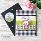 Handmade greeting card with a pig on it and sending you hogs and kisses sentiment on it with a pig envelope seal next to it.