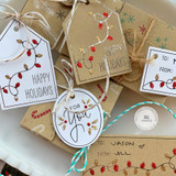 Handmade gift tags with various holiday sentiments on each.