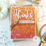 Handmade greeting card with swirls on it and thanks for your kindness sentiment on it with flowers in background.