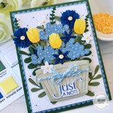 Handmade greeting card with flowers in a pail with just a note sentiment on it.
