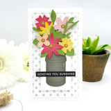 Handmade greeting card with bouquet of flowers in vase and sending you sunshine sentiment on it.