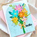 Handmade greeting card with bouquet of flowers on it and hello sentiment on it.