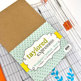 Image of Woodgrain Cardstock - Kraft in its packaging which is a brown cardstock.