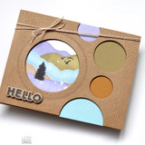 Handmade greeting card with landscape on it and hello sentiment on it.