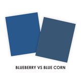 A graphic comparing two Taylored Expressions Premium Cardstock colors—Blueberry and Blue Corn—both rich, darker shades of blue, with Blueberry appearing slightly brighter and Blue Corn deeper and moodier.