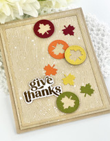 Handmade greeting card with leaves on it and give thanks sentiment on it.