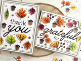 Two handmade greeting cards with fall leaves and acorns on each and one with thank you sentiment on it and the other grateful for you sentiment on it.