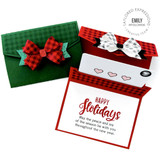 Two handmade gift card wallets with holiday decor and a bow on them.