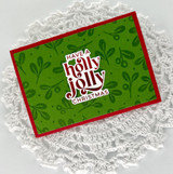 Handmade gift card wallet with have a holly jolly Christmas sentiment on it.
