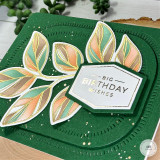 Handmade greeting card with a branch with leaves on it and big birthday wishes sentiment on it.