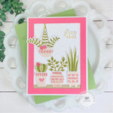 Handmade greeting card with plants in pots on it with free hugs sentiment on it.