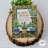 Handmade greeting card with plants in pots on it with happy birthday to my favorite plant lady sentiment on it.