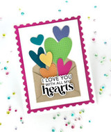 Handmade greeting card with hearts on it and I love you with all my hearts sentiment on it with dots in background.