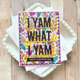 Handmade greeting card with fall leaves on it with I yam what I yam, happy thanksgiving sentiment on it with cardstock on it.