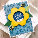 Handmade greeting card with shaker flower on it and bumble bees with big hugs sentiment on it.