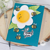Handmade greeting card of flowers and bumble bees on it with thank you sentiment on it.