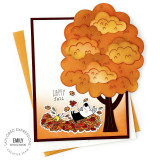 Handmade greeting card with dog and bird in leaves by tree with happy fall sentiment with cardstock in background.
