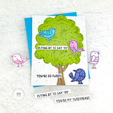 Handmade greeting card with doodle birds on tree with flying by to say hi and you're so tweet sentiment with doodle birds in background.