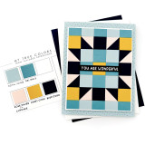 Handmade greeting card with patterned background with you are wonderful sentiment on it with cardstock in background.