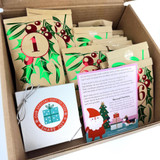 Inside of Advent Calendar Box with a special gift inside and the advent calendar items wrapped up. Inside of Advent Calendar Box with a special gift inside and the advent calendar items wrapped up.