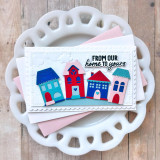 Handmade greeting card with houses and clouds on it and from our home to yours sentiment on it.