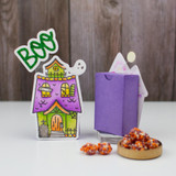 Two handmade treat boxes with haunted houses on each of them with one showing the back of the treat box.