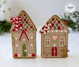 Two handmade treat boxes shaped like gingerbread houses.