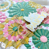 Up close of a handmade greeting card with paper fans on it and let's party sentiment on it.