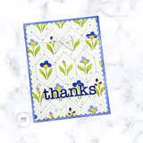 Handmade greeting card with flowers on it and thanks sentiment on it.