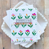 Handmade greeting card with flowers on it and thinking of you sentiment on it.