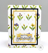 Handmade greeting card with flowers on it and with sympathy sentiment on it.