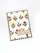 Handmade greeting card with flowers on it and hello friend sentiment on it.