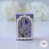 Small handmade gift box with flower on it with purple enamel dots on it.