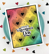 Handmade greeting card of fun shaped hearts and happy valentine's day sentiments on it with paper hearts in the background.