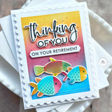 Handmade greeting card with three colorful fish on it and thinking of you on your retirement sentiments on it with cardstock in background.
