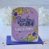 Handmade greeting card with flowers on it and thinking of you on your special day sentiments on it with flowers in background.